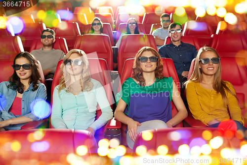 Image of happy friends watching movie in 3d theater