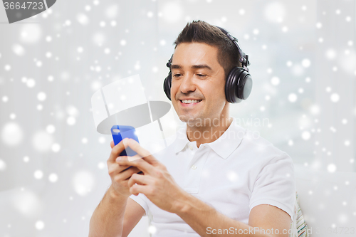 Image of happy man with smartphone and headphones