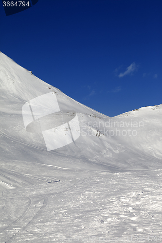 Image of Snowy skiing piste in nice sun day