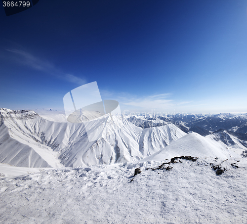 Image of Winter snowy mountains and blue sky