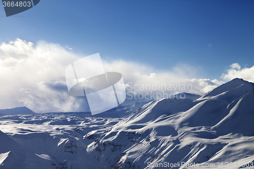 Image of Evening sunlight mountains in cloud