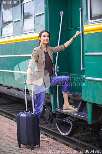 Image of woman at the door of an old railcar