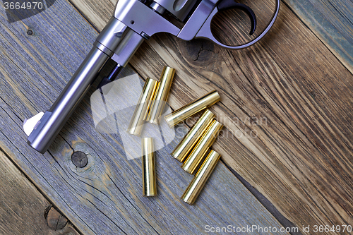 Image of Vintage revolver Nagant and the seven golden cartridges