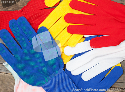 Image of varicolored workers gloves