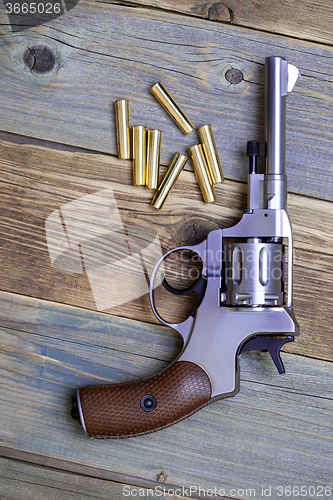 Image of Vintage revolver nagant with seven cartridges