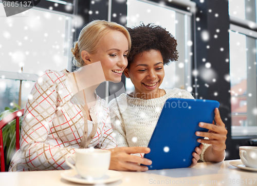Image of happy women with tablet pc and coffee at cafe