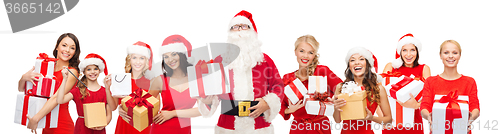Image of santa calaus and happy women with gift boxes