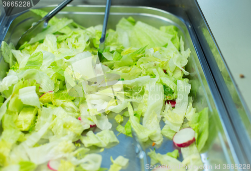 Image of close up of romaine lettuce salad in container