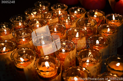 Image of Temple candles in transparent chandeliers