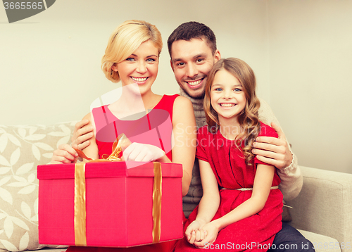 Image of happy family opening gift box