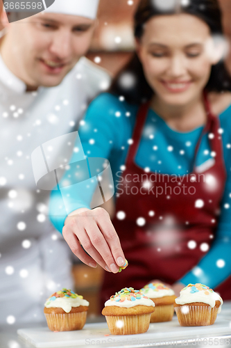 Image of happy woman and chef cook baking in kitchen