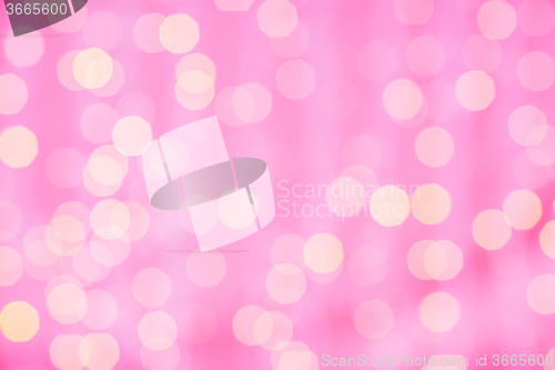 Image of pink blurred background with bokeh lights