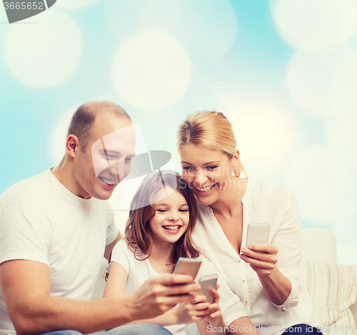 Image of happy family with smartphones