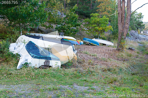 Image of small boat on land for the winter