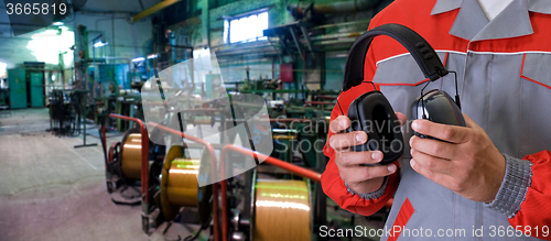 Image of Worker with protective headphone