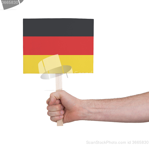 Image of Hand holding small card - Flag of Germany