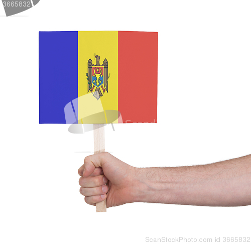 Image of Hand holding small card - Flag of Moldova