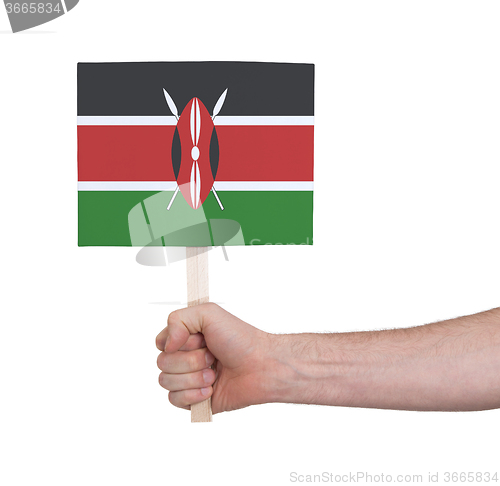 Image of Hand holding small card - Flag of Kenya