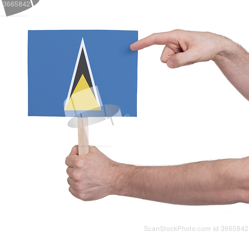 Image of Hand holding small card - Flag of Saint Lucia