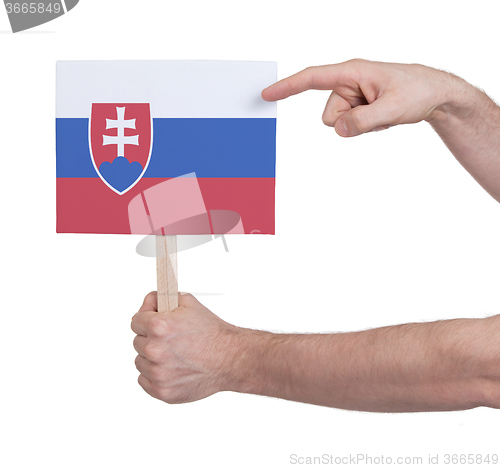 Image of Hand holding small card - Flag of Slovakia