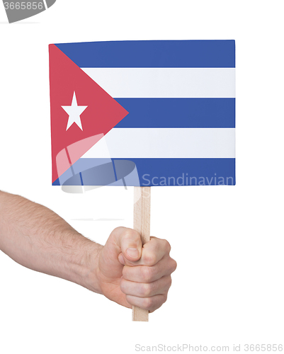 Image of Hand holding small card - Flag of Cuba