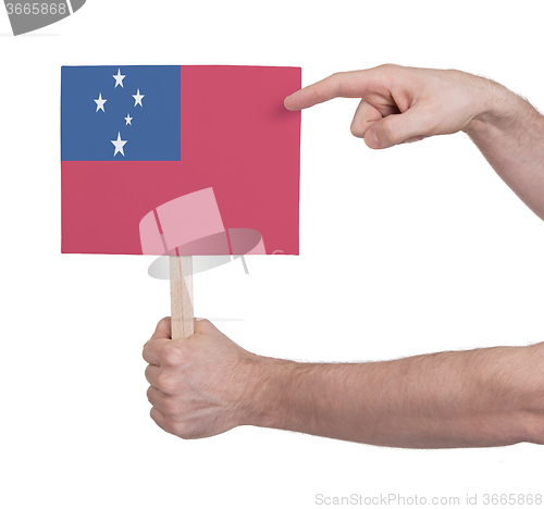 Image of Hand holding small card - Flag of Samoa