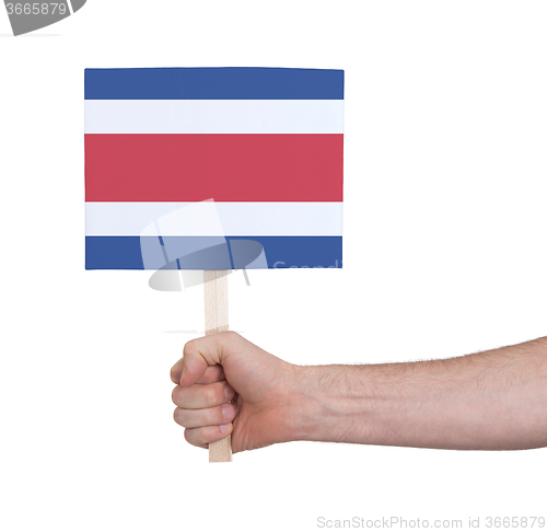 Image of Hand holding small card - Flag of Costa Rica