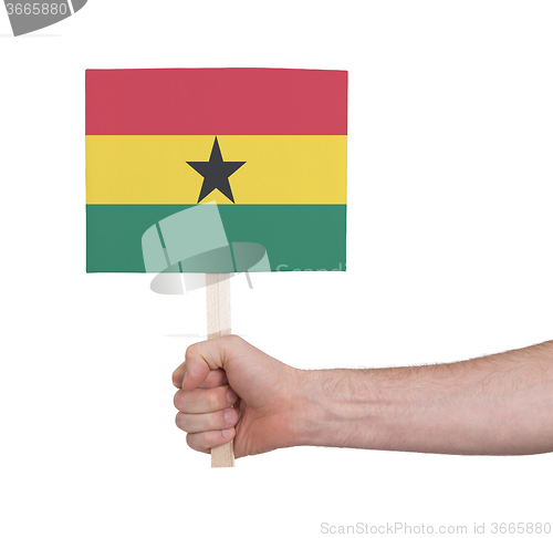 Image of Hand holding small card - Flag of Ghana