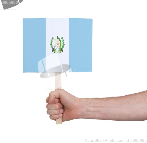 Image of Hand holding small card - Flag of Guatemala