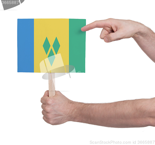 Image of Hand holding small card - Flag of Saint Vincent and the Grenadin