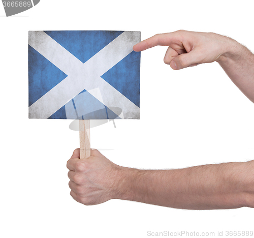 Image of Hand holding small card - Flag of Scotland