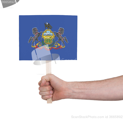 Image of Hand holding small card - Flag of Pennsylvania