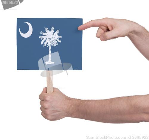 Image of Hand holding small card - Flag of Oklahoma