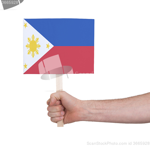 Image of Hand holding small card - Flag of Philipines