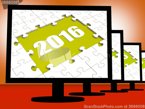 Image of Two Thousand And Sixteen On Monitors Shows Year 2016 Resolution