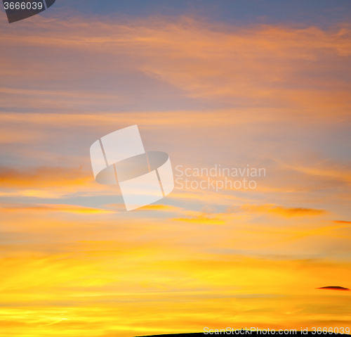 Image of sunrise in the colored sky white soft clouds and abstract backgr