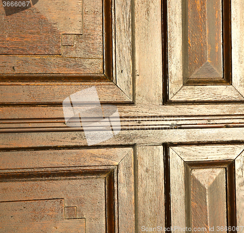 Image of  red abstract  house door    in italy     the milano old        