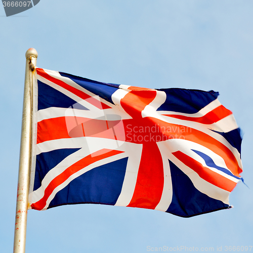 Image of waving flag in the blue sky british colour and wave