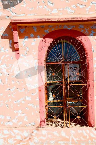 Image of   window in morocco africa  and brown wall  
