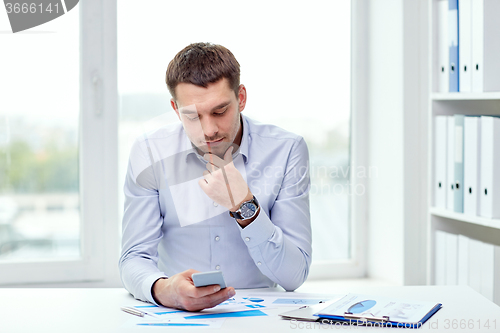 Image of close up of businessman with smartphone