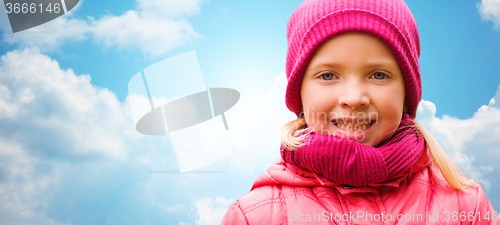 Image of happy beautiful little girl portrait over blue sky