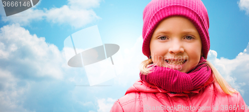 Image of happy beautiful little girl portrait over blue sky