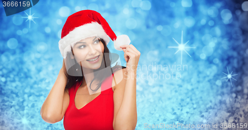 Image of beautiful sexy woman in santa hat and red dress