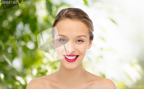 Image of smiling young woman face and shoulders