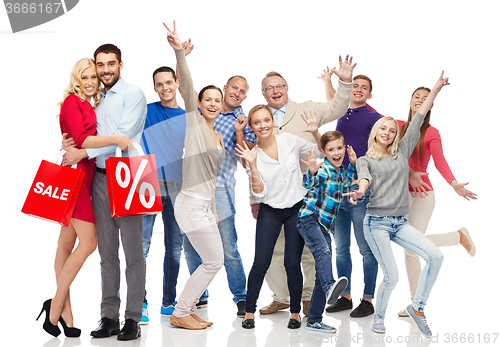 Image of happy people with shopping bags having fun
