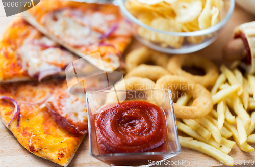 Image of close up of fast food snacks on wooden table