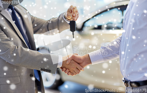 Image of close up of handshake in auto show or salon