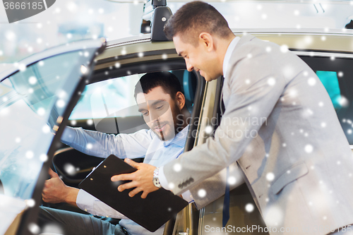Image of happy man with car dealer in auto show or salon