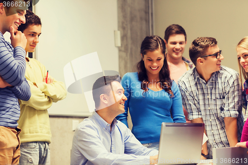 Image of group of students and teacher with laptop