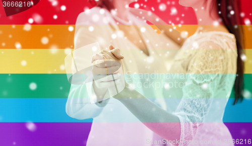 Image of close up of happy married lesbian couple dancing